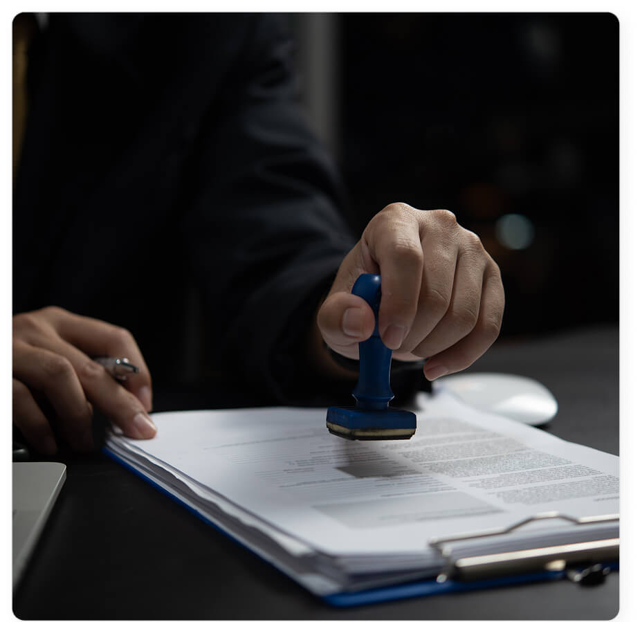 Person stamping a document